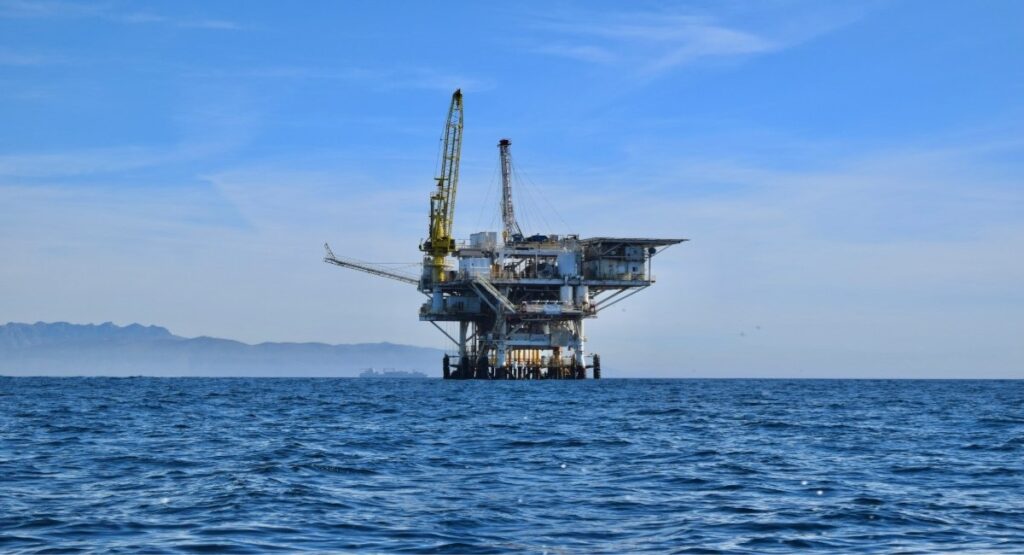 Offshore oil rig requiring rotational crew travel and logistics coordination