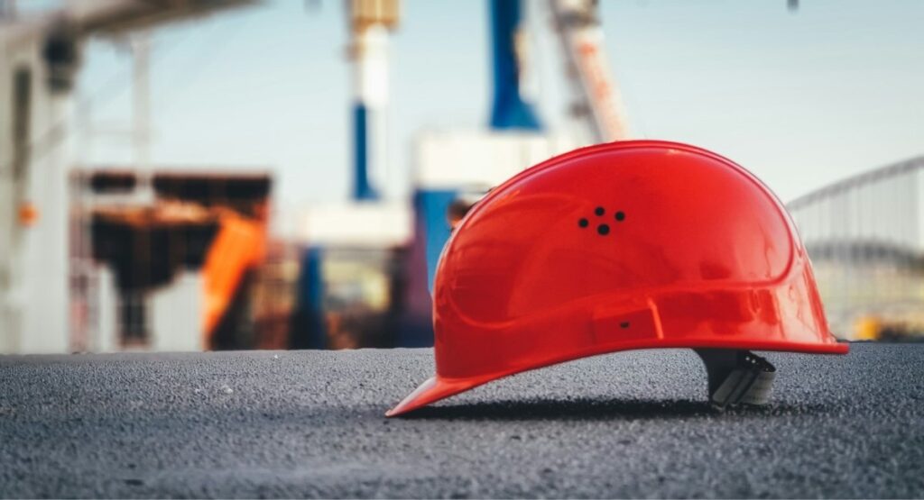 Safety helmet at a construction site where crew travel management is essential