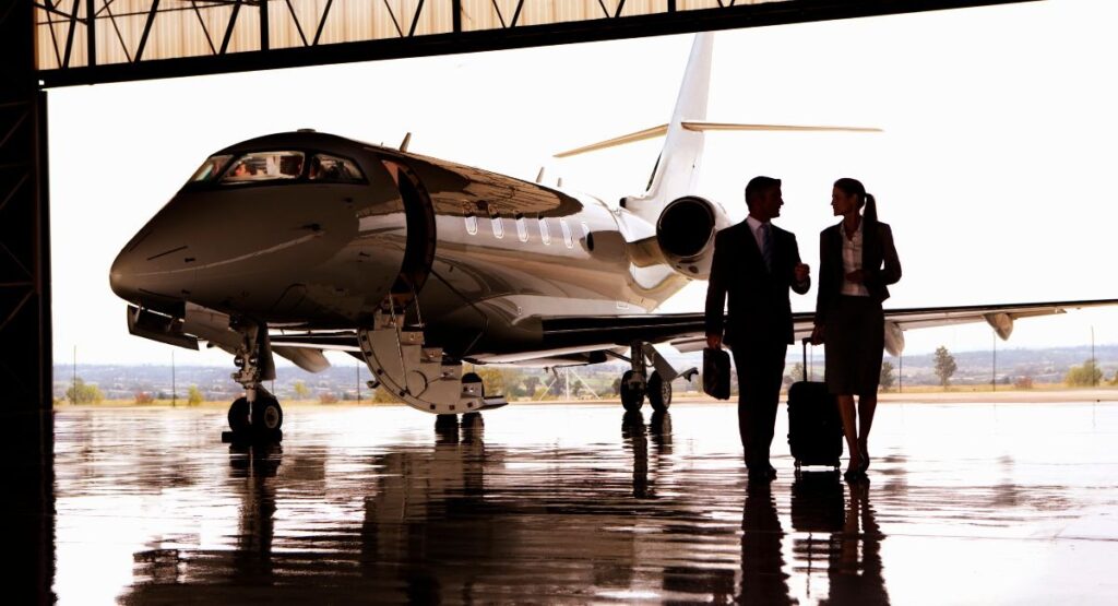 Business Professionals next to a Private Jet
